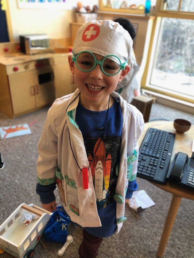 child dressed up like surgeon